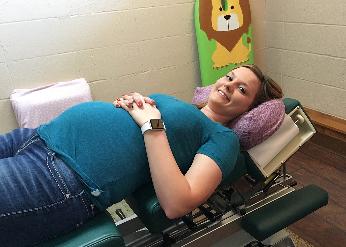pregnant woman in chiropractic chair